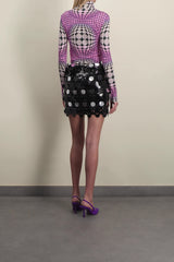 Sparkle mini skirt with circular mirror-effect discs