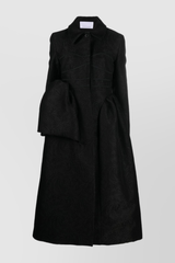 Fitted black coat with asymmetric side panels